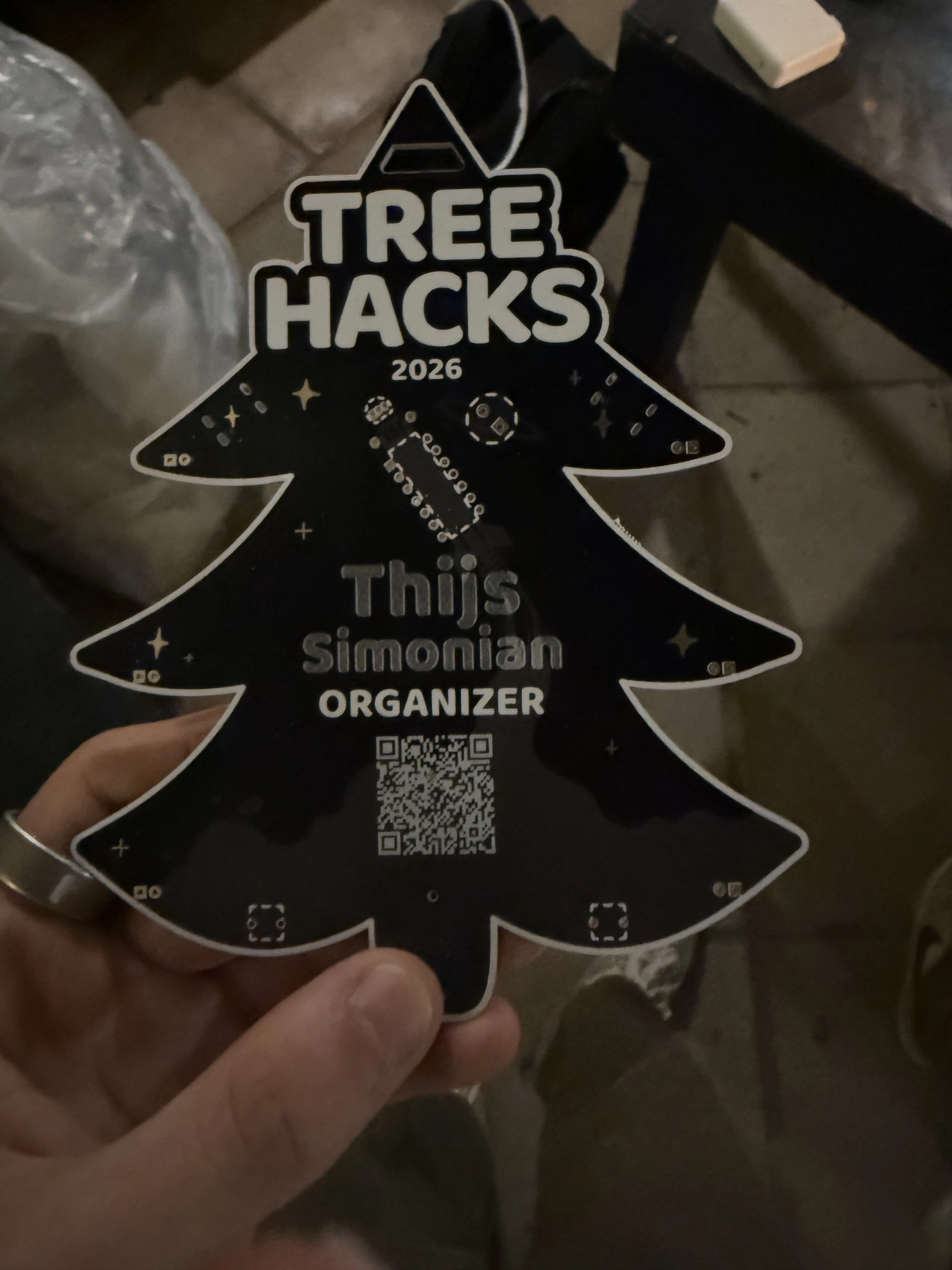 The first badge with a lasered name and QR code