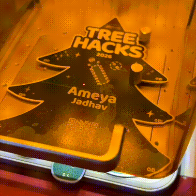 A laser engraving a name onto a badge